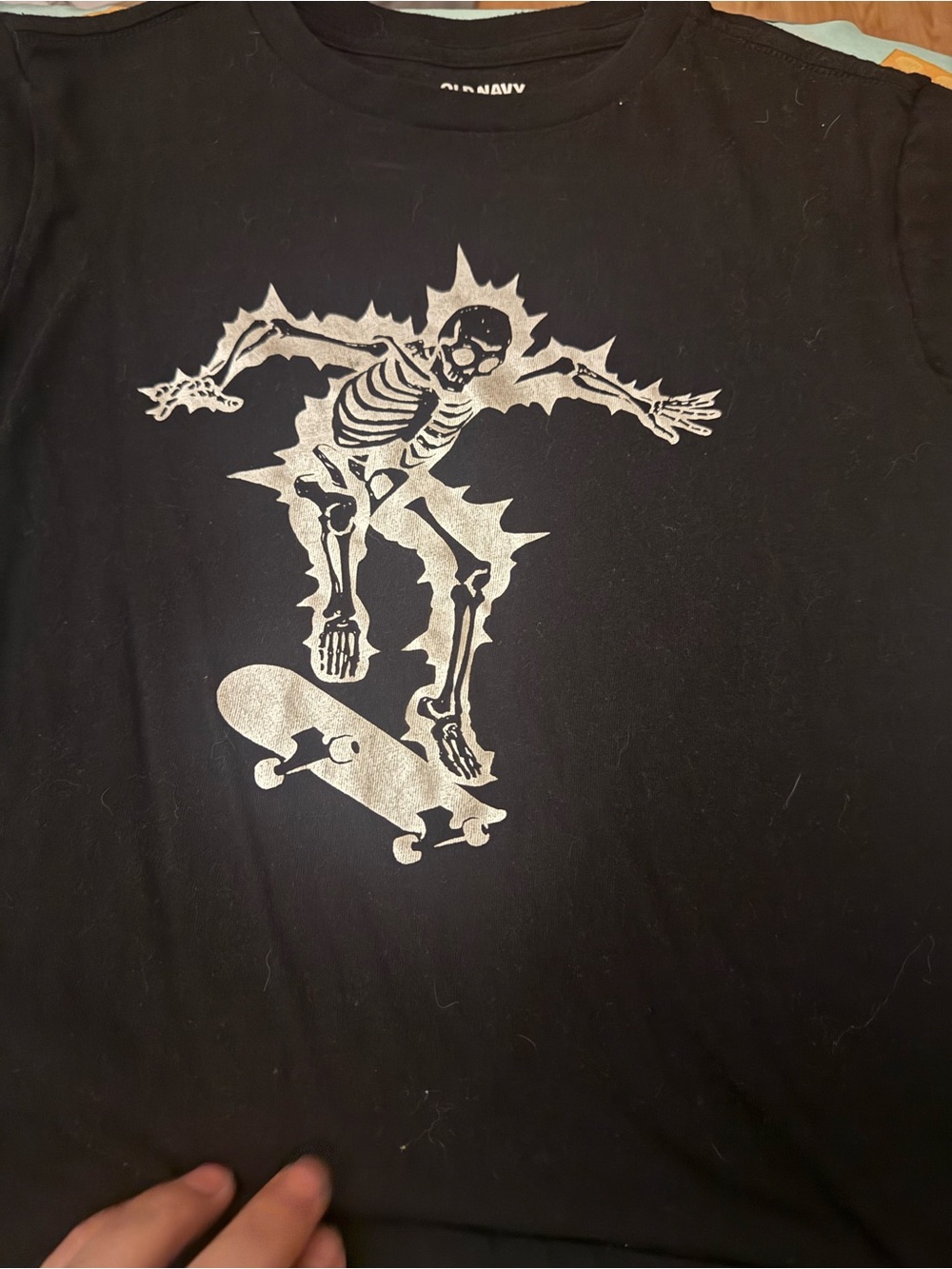Old Navy Black Tee with Silver Skateboarding Skeleton Graphic